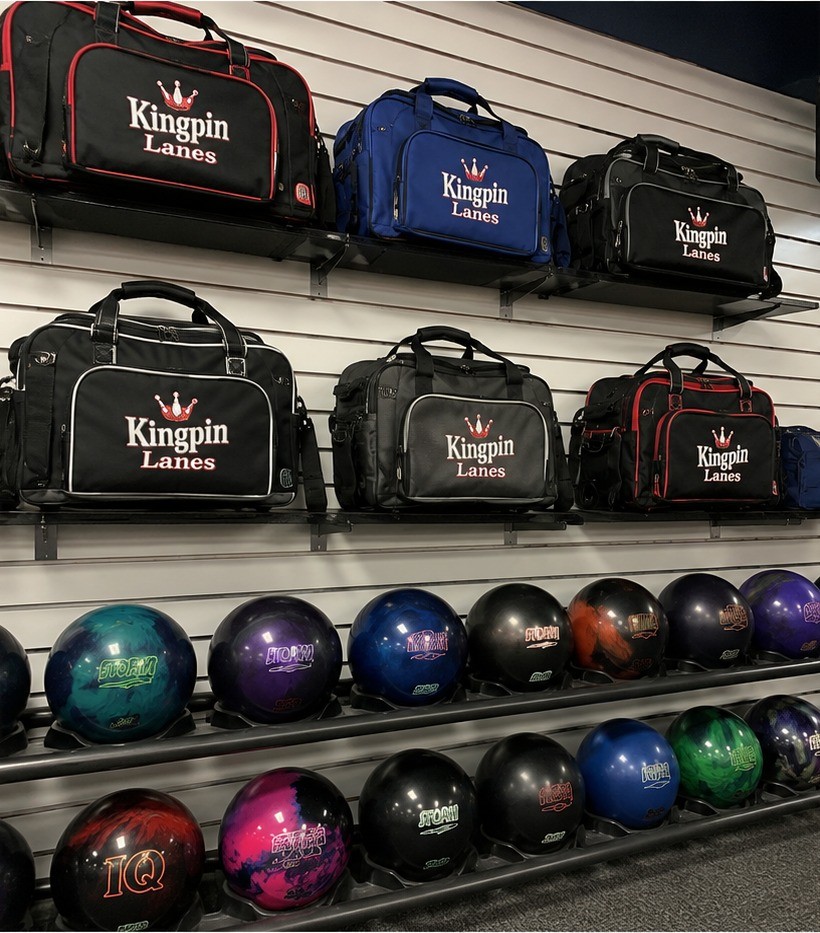 Custom branded bowling bags for a bowling alley pro shop retail wall